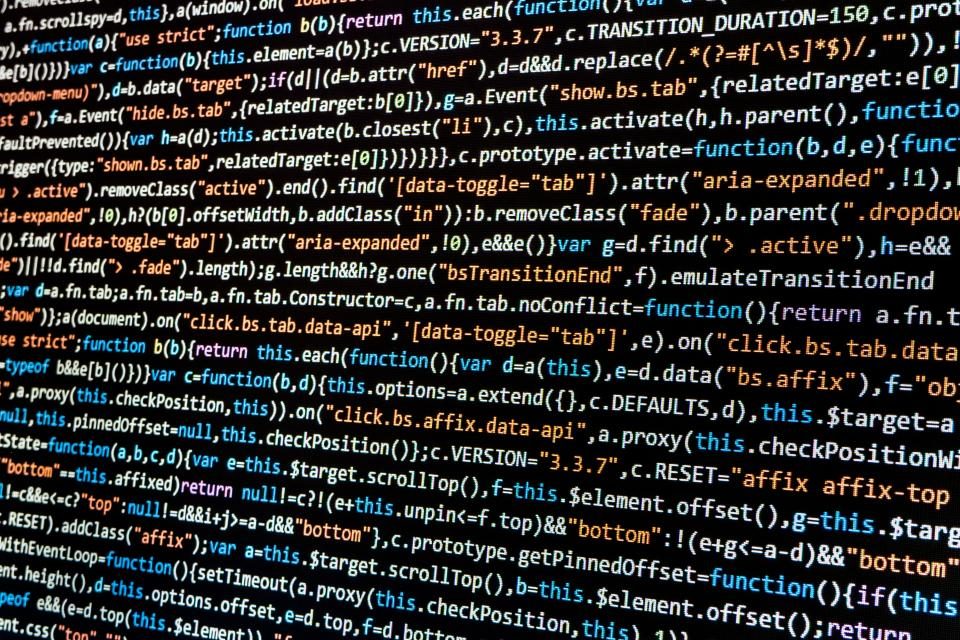 Source code on a screen — compiling freezes these decisions into a single lump